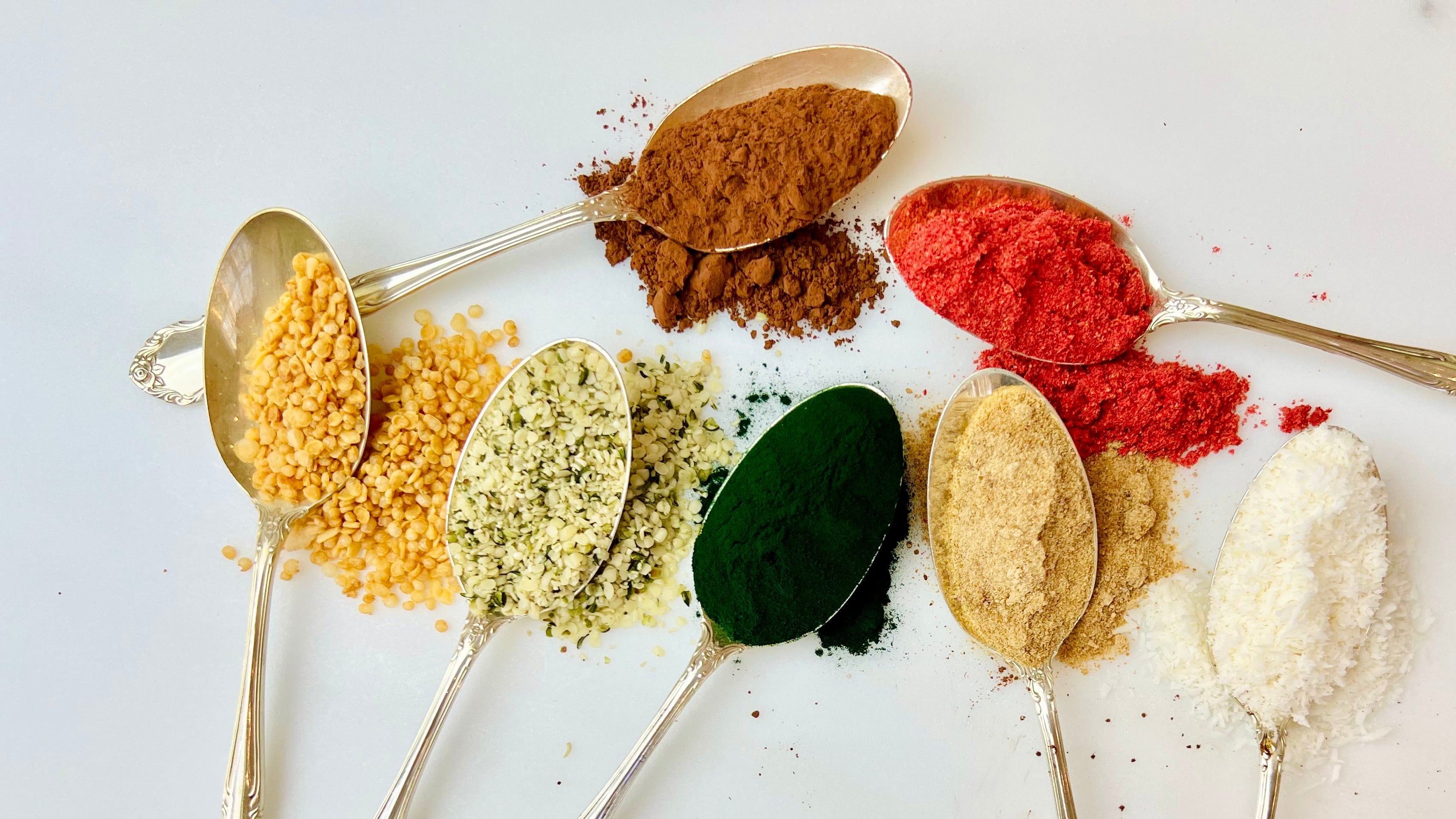 Raw ingredients on silver spoons